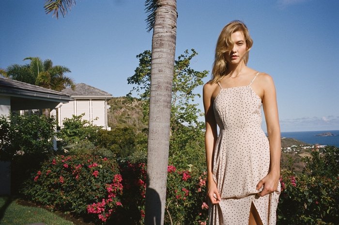 Karlie Kloss promoting her affordable fashion collection with Express