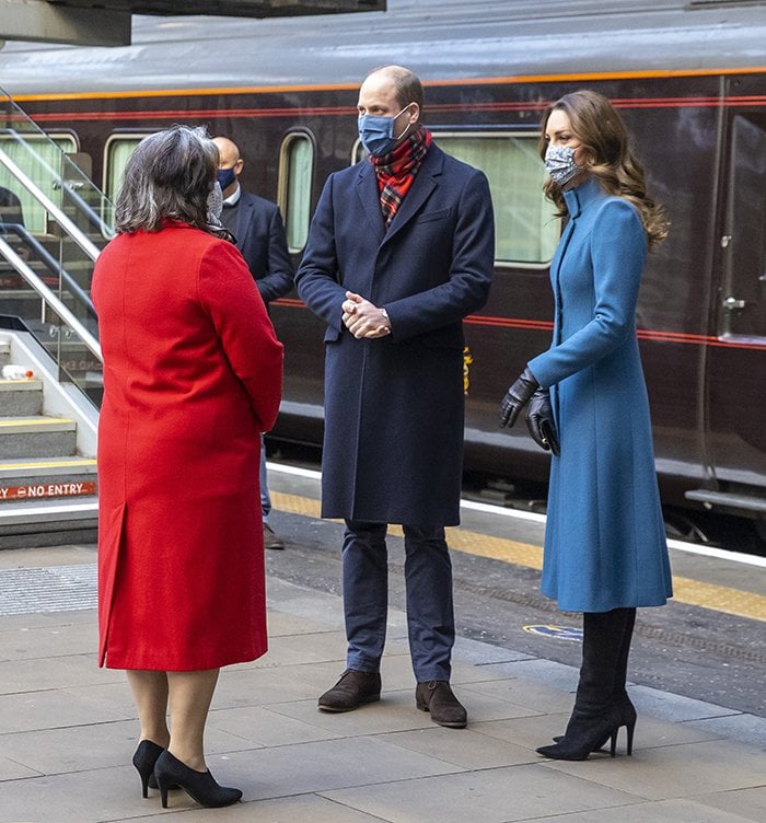 Prince William and Kate Middleton meet the Deputy Lord Lieutenant Sandra Cumming as they arrive by train at Edinburgh Waverley Station on December 7, 2020