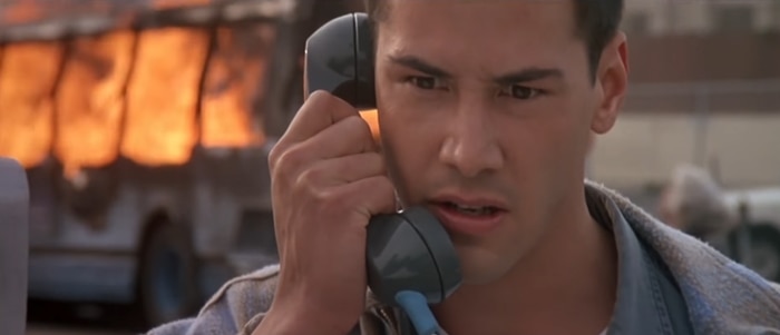 Keanu Reeves, at 29 years old, takes on the intense role of Officer Jack Traven in the 1994 action-packed thriller Speed