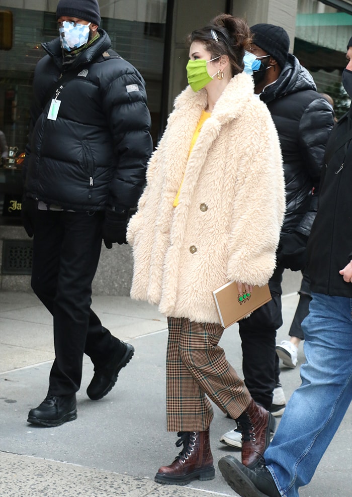 Selena Gomez wearing a Free People faux-fur coat with Veronica Beard plaid granda pants on the set of her Hulu series Only Murders in the Building on December 8, 2020