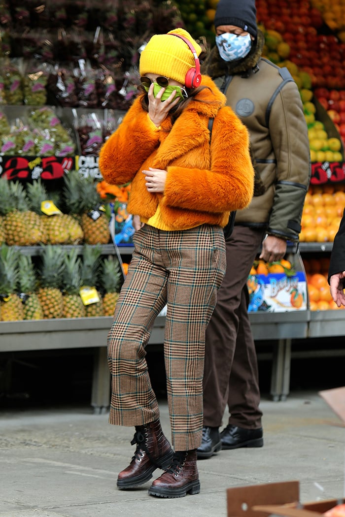 Selena Gomez in Michael Kors faux-fur burnt orange cropped jacket and plaid slacks on December 7, 2020