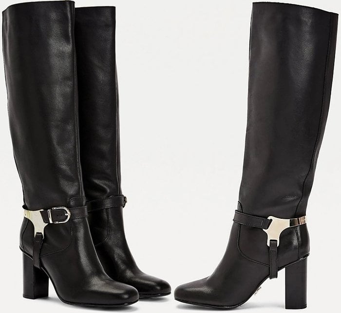 The silver-tone hardware and buckle design around the ankles give these long leather boots an equestrian chic aesthetic