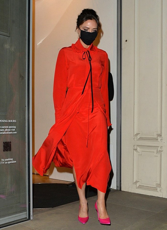 Victoria Beckham wears a flowy red dress from her pre-spring/summer 2021 collection