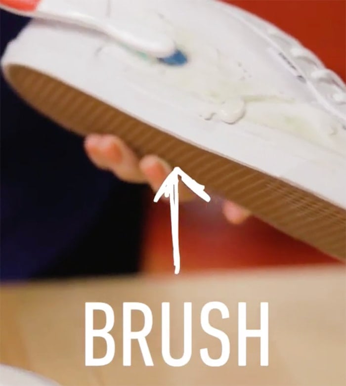 Use the toothbrush and gently brush off the grass stain