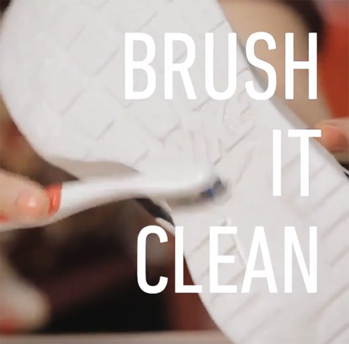 Scrub the wet rubber soles with a toothbrush