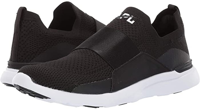 The slip-on Techloom Bliss running shoe features a milled satin elastic strap with raised embossed APL logo that allows for quick ingress and egress providing the ultimate comfort and a seamless fit