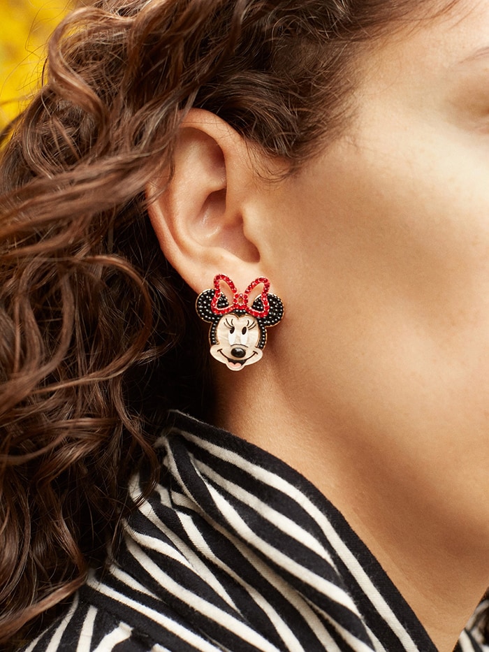 A cute pair of mismatched stud earrings featuring Mickey Mouse and Minnie Mouse