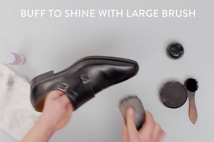 Buff the leather shoes using brisk, back-and-forth movements