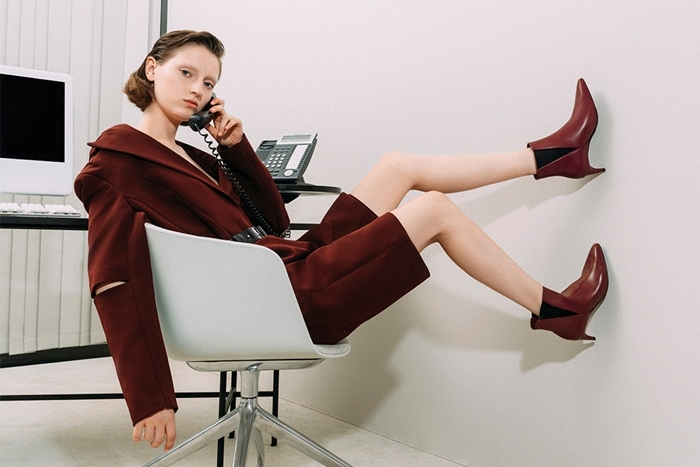 Model wearing Charles & Keith Chelsea boots at the office