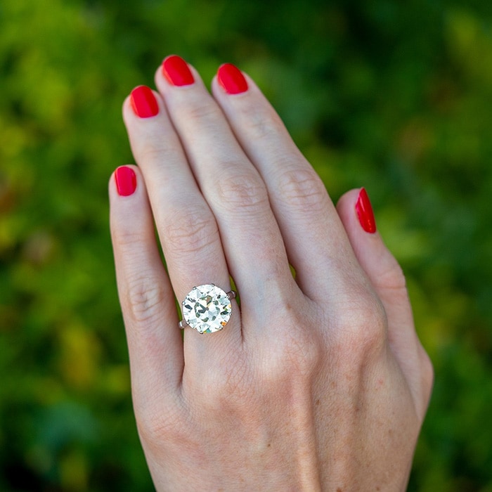 From the 1920's, a magnificent 8-carat old European cut diamond sits on an elegant crown platinum mounting