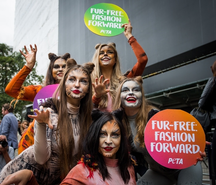 PETA supporters celebrate the news that London Fashion Week will not showcase any animal fur