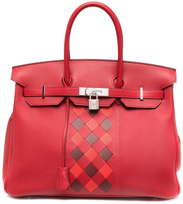 Crafted from feminine decor red leather, this trapeze-shaped tote from Hermès has a smooth finish and silver-tone hardware
