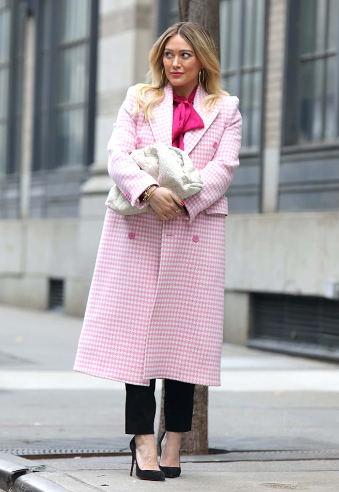 Hilary Duff wearing a pink houndstooth Balenciaga coat with a Chloe pussy-blouse