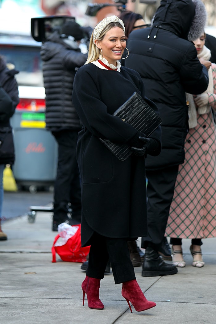 Hilary Duff looks winter chic in a Chloe belted robe coat and a red necktie blouse