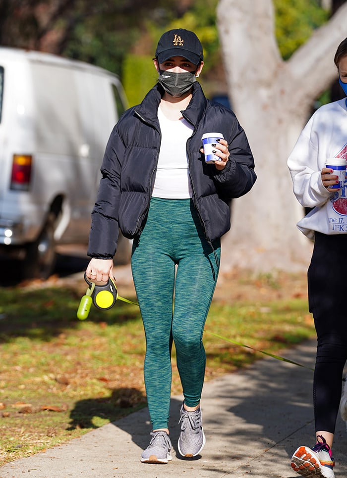 Lucy Hale highlights her toned legs in Outdoor Voices green leggings