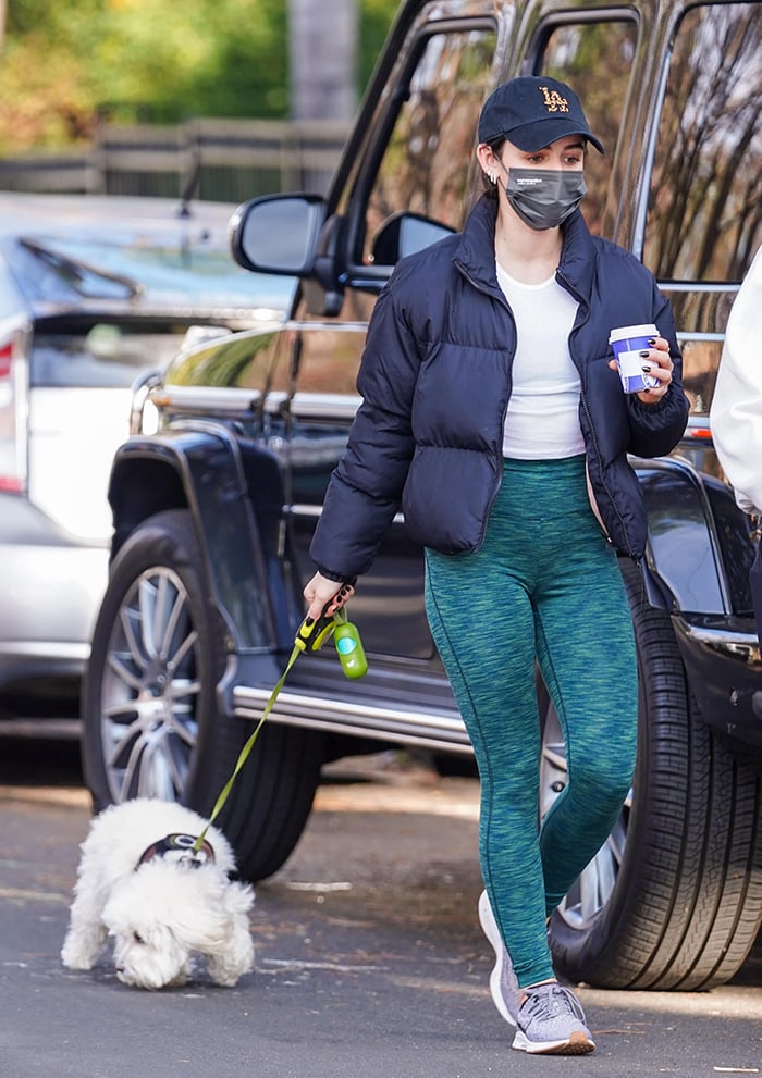 Lucy Hale walks her dog Elvis in Los Angeles on January 5, 2020 after co-hosting Dick Clark’s Rockin’ New Year’s Eve