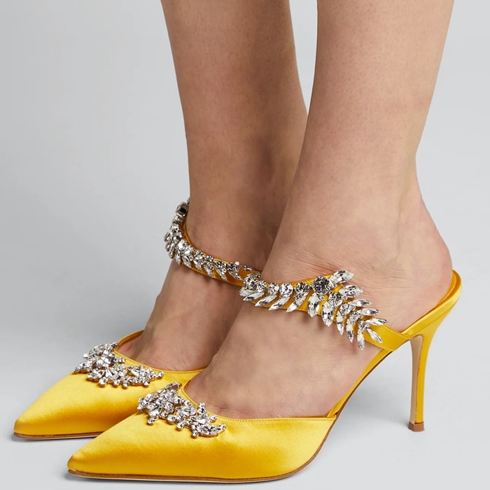 Decadent crystal leaves vine across this pointy-toe satin pump, showcasing Manolo Blahnik's flair for dramatic embellishment