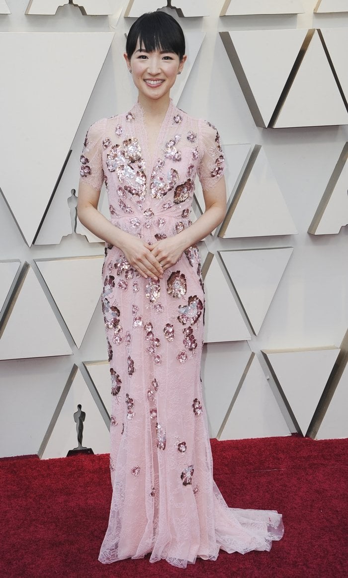 Marie Kondo, whose net worth is estimated to be around $8 million, wore a floor-sweeping Jenny Packham dress at the 91st Annual Academy Awards