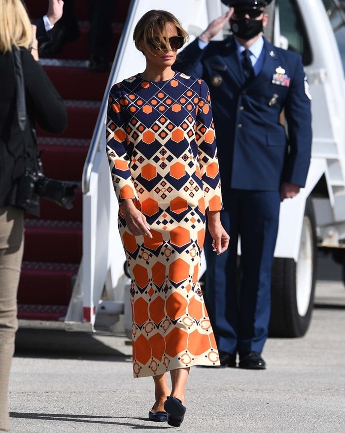 Melania Trump's silk and wool cady maxi dress from Gucci is inspired by the psychedelic prints and distorted imagery of the 1970s