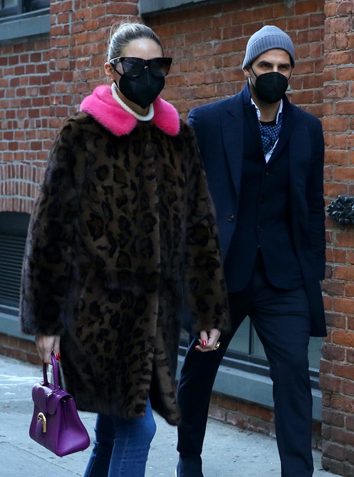 Olivia Palermo adds a purple Delvaux Brilliant bag and tortoise-framed sunglasses to her look