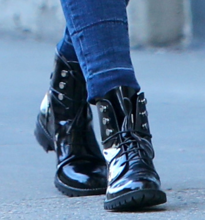 Olivia Palermo adds a hint of tough-chic vibe to her look with Dior Rebelle Army boots