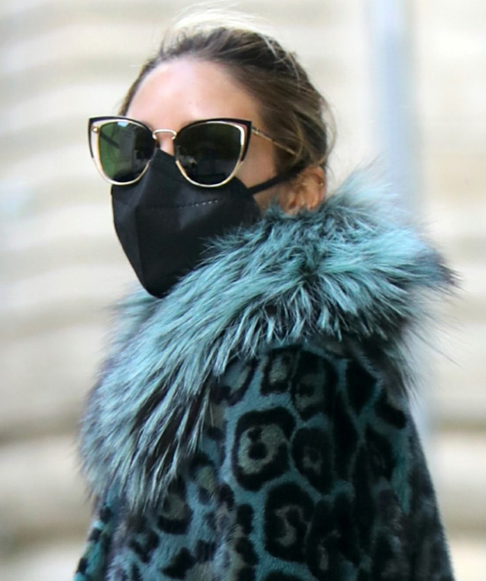 Olivia Palermo styles her look with Salvatore Ferragamo cat-eye sunglasses