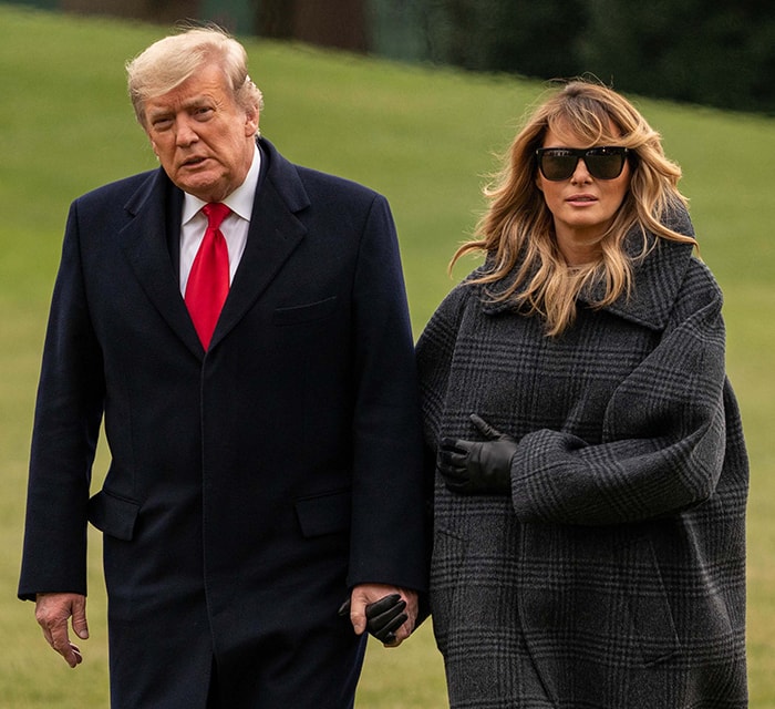 Melania Trump bundles up in an oversized Balenciaga check-print coat