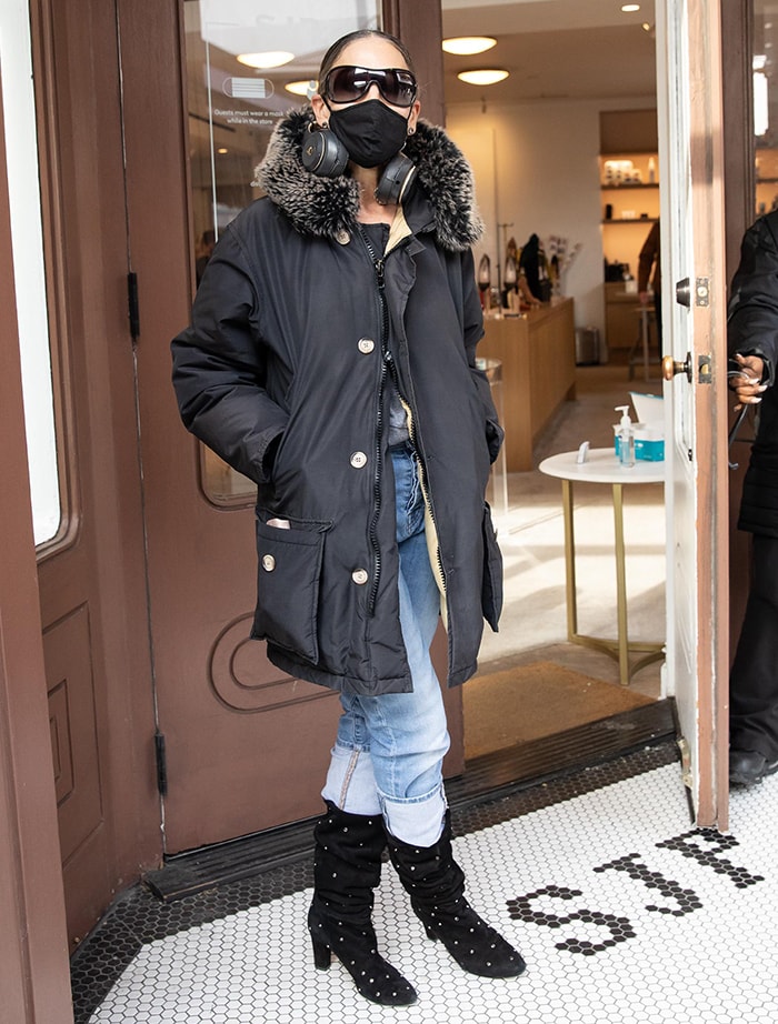 Sarah Jessica Parker looks chic in a faux-fur-trimmed jacket and studded boots at her South Street Seaport boutique on January 13, 2021