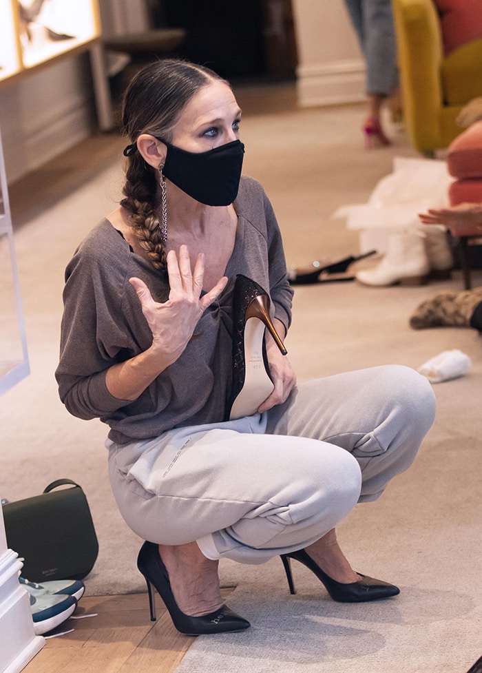 Sarah Jessica Parker wears a v-neck top with Pangaia track pants