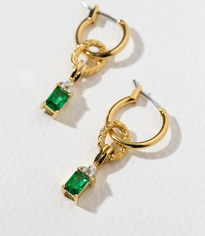 Emerald-colored cubic zirconia crowned with triple crystal cubic zirconia hangs from 24k gold-plated hoops