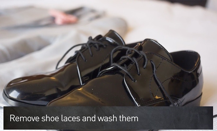 Remove the laces and run them through the washing machine if dirty or replace them