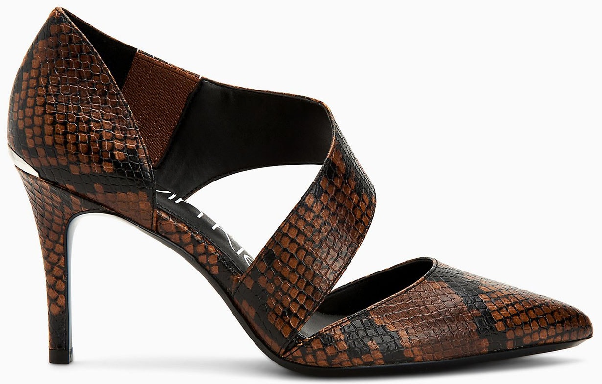 Add a sultry finish to your outfit with Calvin Klein's Gella snake heels with asymmetrical Mary Jane straps