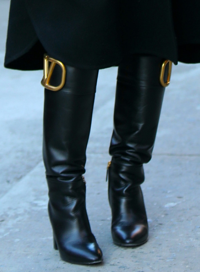 Hilary Duff wearing Valentino Garavani Supervee knee-high boots featuring a gold V-logo plaque lifted from the legendary 1968 Sala Bianca show