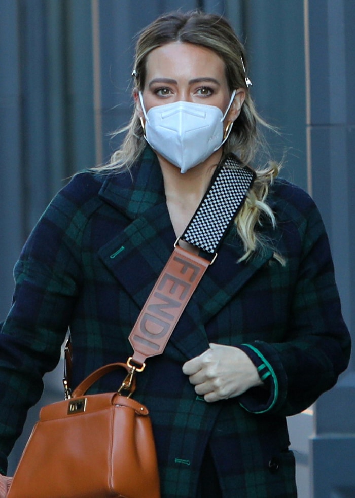 Hilary Duff carries her stuff in thick-strapped brown leather Fendi bag