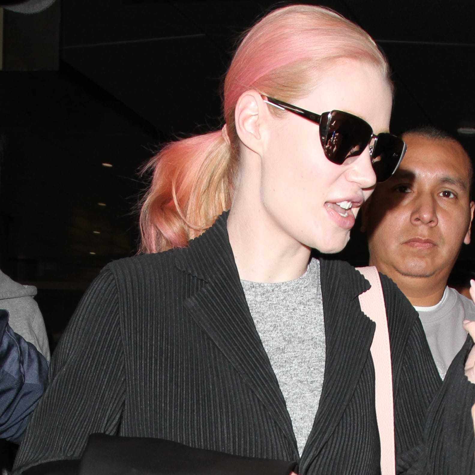 Iggy Azalea is seen with pink hair at LAX