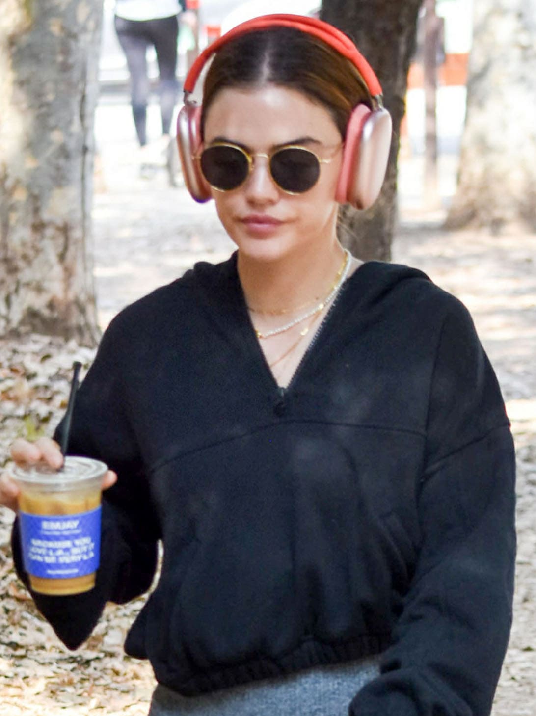 Lucy Hale goes hiking with headphones on