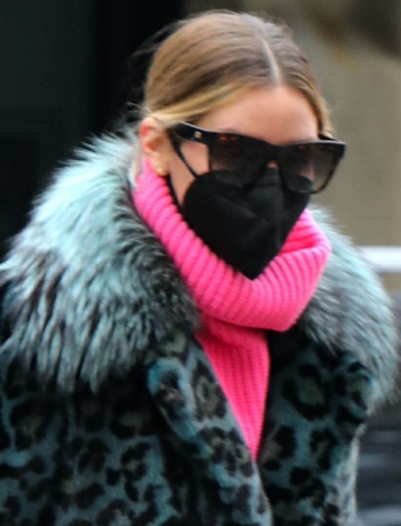 Olivia Palermo keeps a low profile with sunglasses and a face mask