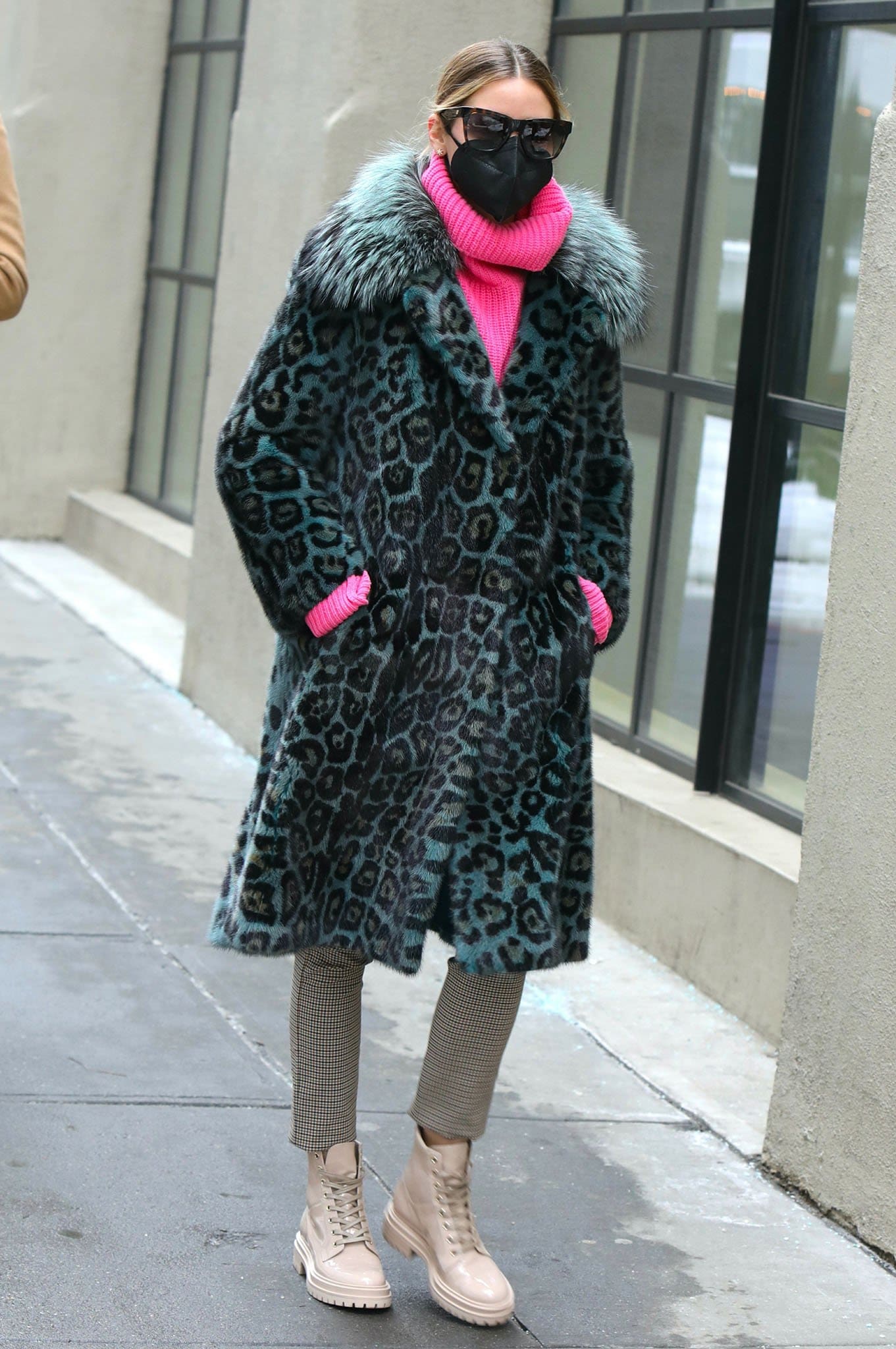 Olivia Palermo wears Cara Mila leopard mink coat over a chunky pink knit sweater