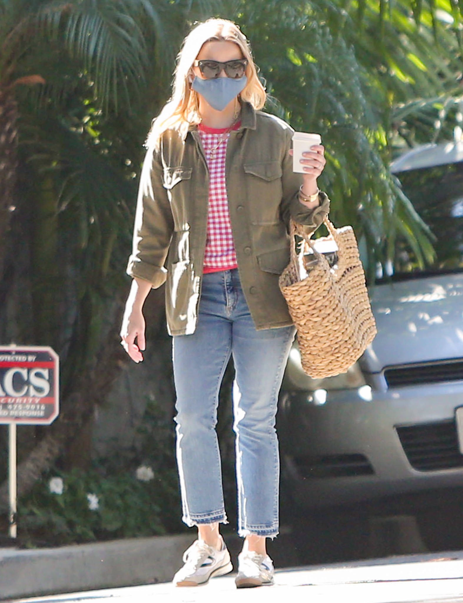 Reese Witherspoon runs errands in Draper James gingham sweater and Topshop jacket in Los Angeles on February 5, 2021