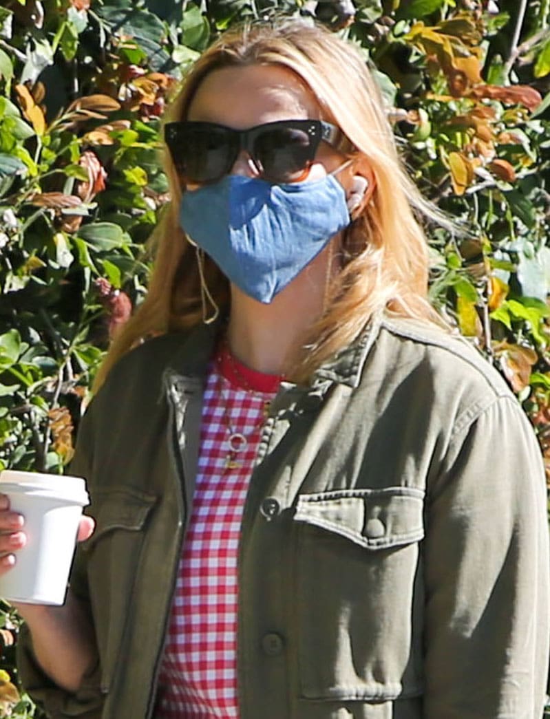 Reese Witherspoon wears Celine sunnies with a denim blue face mask