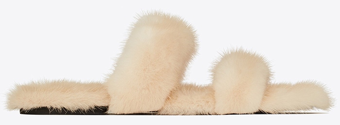Saint Laurent's Bleach slides, crafted in luxurious mink fur, transform a simple jogger outfit into a statement of opulent fashion