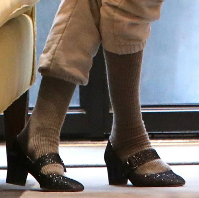 Sarah Jessica Parker teams her sweats with knee-high socks and glittery Mary Jane pumps