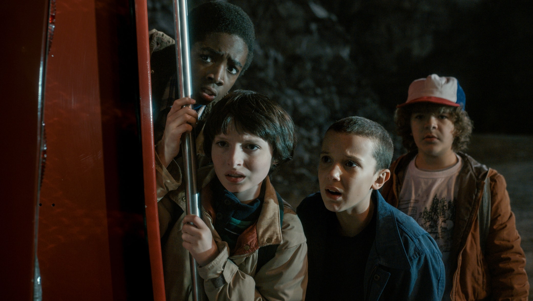 Caleb McLaughlin, Finn Wolfhard, Millie Bobby Brown, and Gaten Matarazzo in the science fiction horror mystery-thriller streaming television series Stranger Things