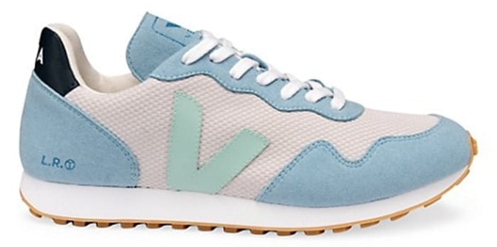 These blue patchwork sneakers lend a high tech mesh design that is offset with contrasting patches