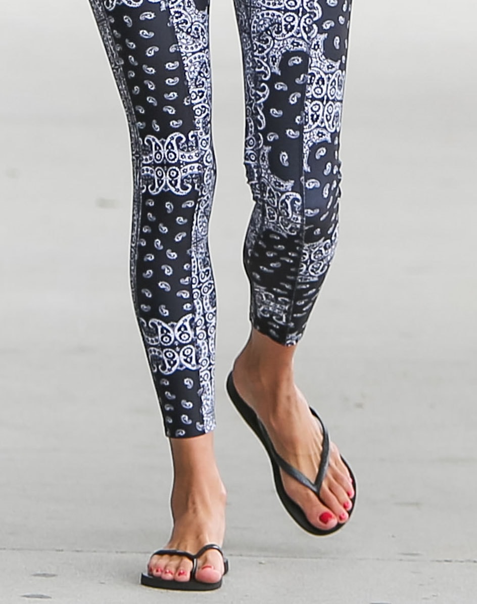 Alessandra Ambrosio pictured wearing flip flops with printed leggings on June 19, 2020