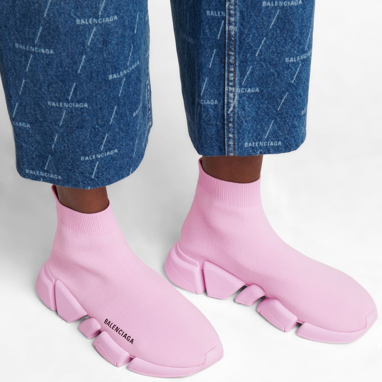 These pink Balenciaga lightweight Speed 2.0 sneakers feature sock-like knit uppers and textured rubber outsole with memory sole and shock absorption technology