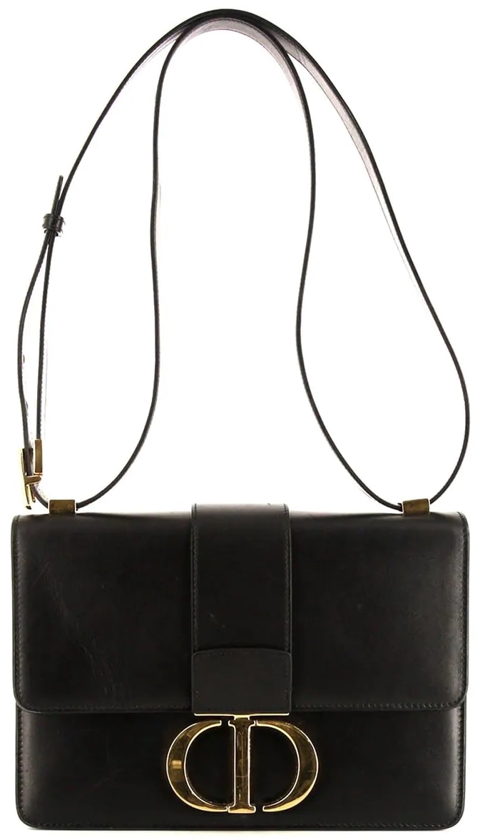 Adorned with a gold-tone CD clasp fastening, this black 30 Montaigne shoulder bag from Christian Dior will boost your looks and your mood