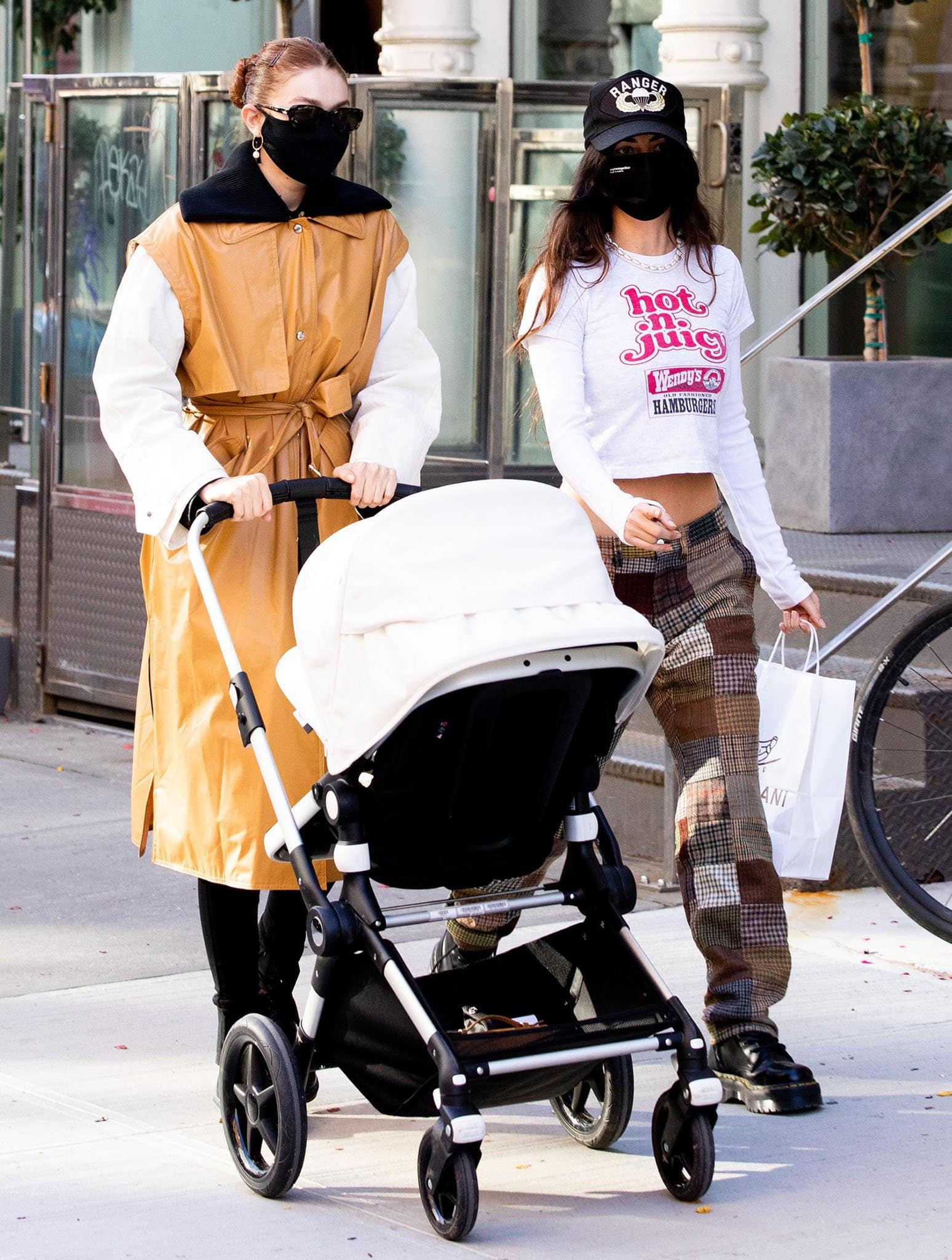 Gigi Hadid strolls around Soho with her daughter Khai and friend Leah McCarthy on March 22, 2021