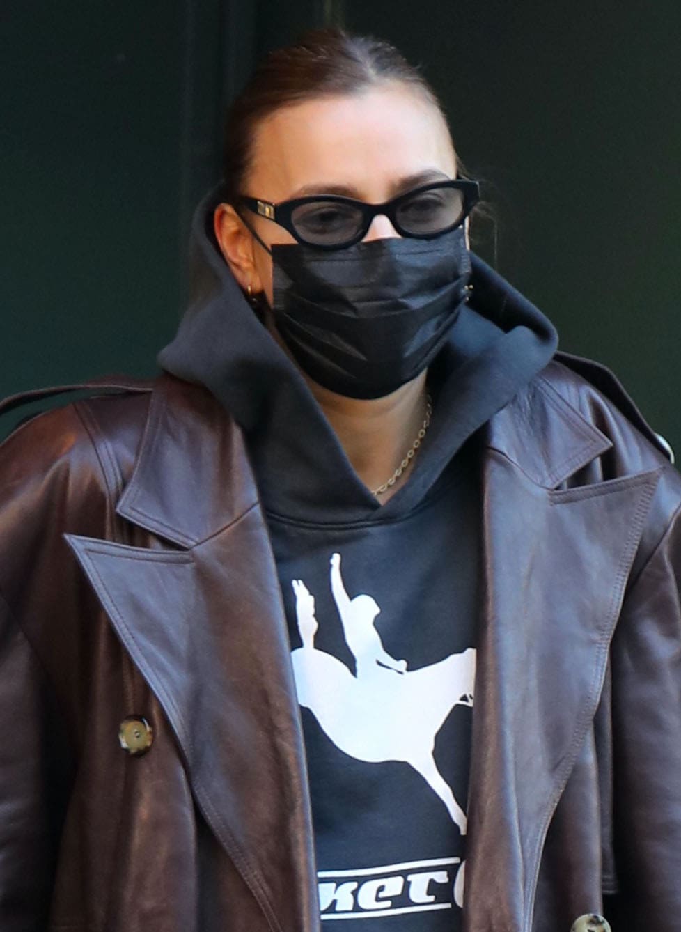 Irina Shayk hides her eyes behind Poppy Lissiman sunglasses and stays safe with a black face mask