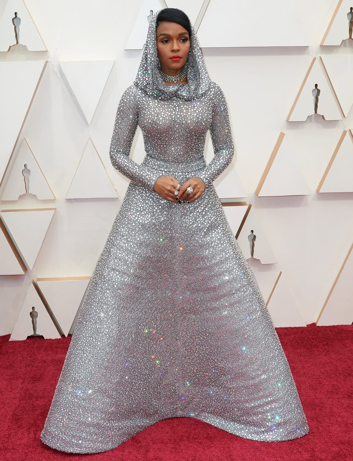Janelle Monáe dazzled in a custom Ralph Lauren Collection metallic tulle-mesh gown adorned with more than 168,000 Swarovski crystals at the 2020 Oscars — a look so intricate it required four people to deliver